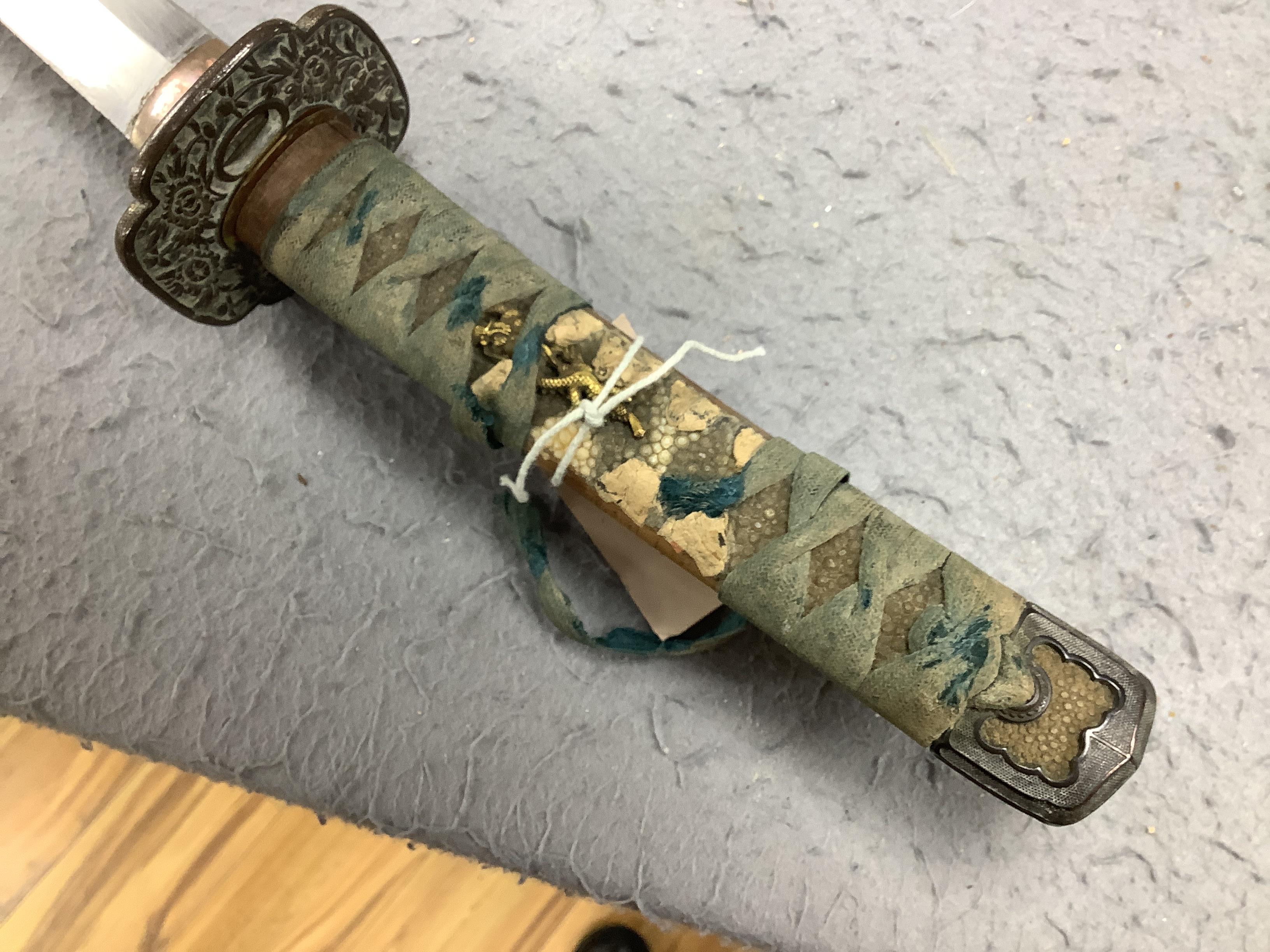 A 19th century Japanese katana with signature to the tang, with chiselled bronze tsuba and gilt metal menuki, and six various knives, blade 57cm